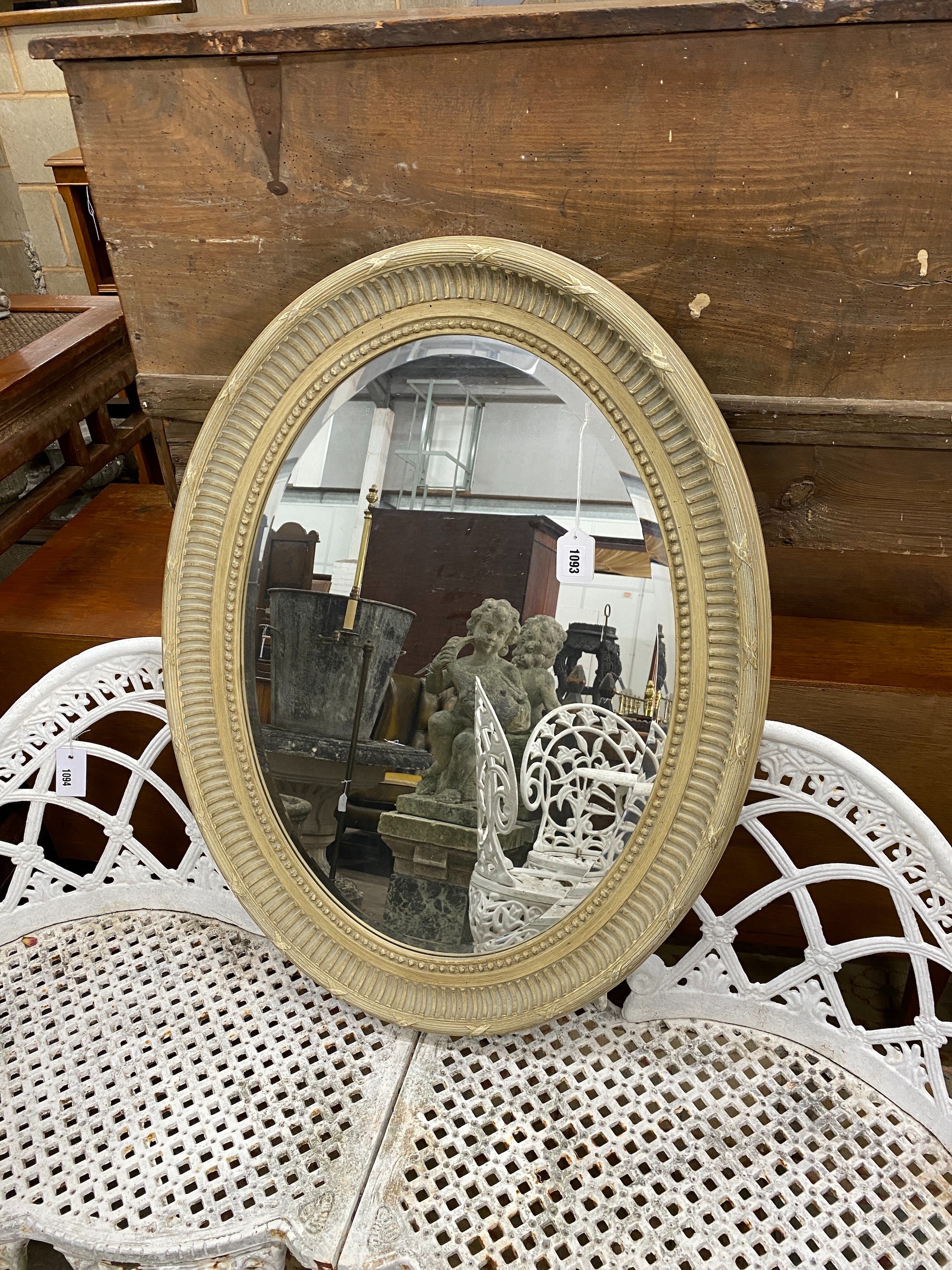 A modern oval painted Victorian style wall mirror, width 67cm, height 87cm